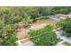 Aerial view of a simple neighborhood playground with minimal play equipment and shade at 13643 Tramore Dr, Odessa, FL 33556