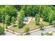 A modern neighborhood playground with multiple play structures surrounded by mature trees at 13643 Tramore Dr, Odessa, FL 33556