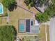 Aerial view of a single-Gathering home featuring a screened-in pool and solar panels on the roof at 13835 Pathfinder Dr, Tampa, FL 33625