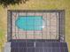Overhead view of a screened-in pool with a paver deck and solar panels at 13835 Pathfinder Dr, Tampa, FL 33625