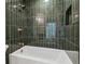 Beautiful bathroom featuring a tiled shower and tub with bronze finish hardware at 13835 Pathfinder Dr, Tampa, FL 33625