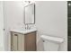 This bathroom features a modern vanity with neutral wood tones and quartz countertops at 13835 Pathfinder Dr, Tampa, FL 33625