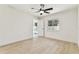 Bright bedroom with a ceiling fan, hardwood floors, and access to the pool at 13835 Pathfinder Dr, Tampa, FL 33625