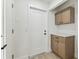 The foyer features modern cabinets, white walls, and tiled floors at 13835 Pathfinder Dr, Tampa, FL 33625