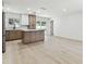 Modern kitchen with an island, stainless steel appliances, and hardwood floors at 13835 Pathfinder Dr, Tampa, FL 33625