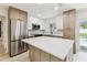 Well-equipped kitchen with stone countertops and modern stainless-steel appliances at 13835 Pathfinder Dr, Tampa, FL 33625