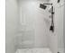 Modern shower features a glass enclosure, rainfall shower head, and stylish tile at 13835 Pathfinder Dr, Tampa, FL 33625
