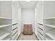 Spacious walk-in closet features custom shelving and ample storage space at 13835 Pathfinder Dr, Tampa, FL 33625