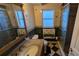 Bathroom featuring a vanity, toilet, mirror, and walk-in shower at 1538 S Lake Ave, Clearwater, FL 33756