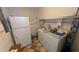 Functional laundry room featuring modern appliances and ample storage space at 1538 S Lake Ave, Clearwater, FL 33756
