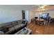 Spacious living room with hardwood floors, neutral paint, and dining table at 1538 S Lake Ave, Clearwater, FL 33756