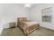 Cozy bedroom with natural light, carpeted floor, and simple furnishing at 15615 Indian Queen Dr, Odessa, FL 33556