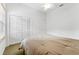 Bright bedroom featuring a ceiling fan, carpet, and closet space at 15615 Indian Queen Dr, Odessa, FL 33556