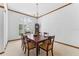 Formal dining room with decorative chandelier, large windows and comfortable seating at 15615 Indian Queen Dr, Odessa, FL 33556
