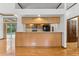 Spacious kitchen featuring quartz countertops, breakfast bar, and stainless steel appliances at 15615 Indian Queen Dr, Odessa, FL 33556