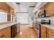 Eat-in kitchen with quartz countertops, stainless steel appliances, and maple cabinets at 15615 Indian Queen Dr, Odessa, FL 33556