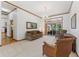 Cozy living room with comfortable seating, sliding glass doors, and wood trim at 15615 Indian Queen Dr, Odessa, FL 33556