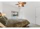 Bedroom with a large bed and sliding doors out to the pool at 15615 Indian Queen Dr, Odessa, FL 33556