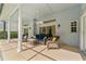 Covered patio area with comfortable seating, perfect for relaxing outdoors at 15615 Indian Queen Dr, Odessa, FL 33556