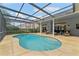 Inviting pool with screened enclosure and outdoor seating area at 15615 Indian Queen Dr, Odessa, FL 33556