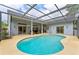 Beautiful pool and patio area with a screened enclosure at 15615 Indian Queen Dr, Odessa, FL 33556