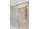 The glass-enclosed shower features mosaic tile accents and upscale shower head at 15615 Indian Queen Dr, Odessa, FL 33556
