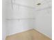 Walk-in closet with simple, white, wire shelving at 15615 Indian Queen Dr, Odessa, FL 33556