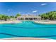 Community pool with surrounding lounge chairs offers a serene space for residents to relax and socialize outdoors at 17510 Bright Wheat Dr, Lithia, FL 33547