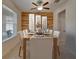 Well-lit dining room with a wooden table and a stunning wood accent wall at 17510 Bright Wheat Dr, Lithia, FL 33547