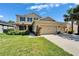 Charming two-story tan home with well-kept lawn and landscaping at 17510 Bright Wheat Dr, Lithia, FL 33547