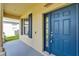 Inviting blue front door with a window and a covered porch at 17510 Bright Wheat Dr, Lithia, FL 33547