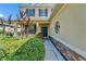Stylish front entrance with decorative stonework and lush landscaping at 17510 Bright Wheat Dr, Lithia, FL 33547