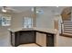 Open-concept kitchen with granite island and stainless steel dishwasher at 17510 Bright Wheat Dr, Lithia, FL 33547