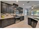 Modern kitchen features stainless steel appliances and granite countertops at 17510 Bright Wheat Dr, Lithia, FL 33547