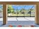 Screened-in lanai area offering views of the backyard at 17510 Bright Wheat Dr, Lithia, FL 33547