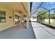 Covered and screened lanai with an outdoor kitchen at 17510 Bright Wheat Dr, Lithia, FL 33547