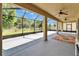 Spacious screened lanai with multiple ceiling fans and view of the backyard at 17510 Bright Wheat Dr, Lithia, FL 33547