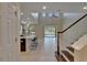 Open concept living room and kitchen boasting soaring ceilings and abundant natural light at 17510 Bright Wheat Dr, Lithia, FL 33547