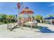 Community splash pad featuring a pirate-themed play structure with slide and net climbing area, perfect for Gathering fun at 17510 Bright Wheat Dr, Lithia, FL 33547