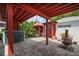 Backyard featuring a covered tiki bar, patio area, tropical foliage and outdoor cooking area at 1963 Edgewater Dr, Clearwater, FL 33755