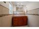 Bathroom with granite countertop, vanity, and wood cabinets at 1963 Edgewater Dr, Clearwater, FL 33755