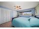 Bright bedroom with a ceiling fan, tile flooring, and closet at 1963 Edgewater Dr, Clearwater, FL 33755