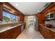 Traditional-style kitchen with granite countertops, stainless steel appliances, and a large window at 1963 Edgewater Dr, Clearwater, FL 33755