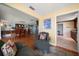 Cozy living room with hardwood floors and comfortable seating that leads to dining area at 1963 Edgewater Dr, Clearwater, FL 33755