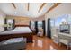Inviting main bedroom with hardwood floors, a view, and neutral tones, creating a relaxing atmosphere at 1963 Edgewater Dr, Clearwater, FL 33755