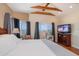 Spacious bedroom features great views, a ceiling fan, and a cozy sitting area at 1963 Edgewater Dr, Clearwater, FL 33755