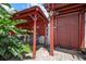 Covered tiki bar area with grill, sink, and island decor, perfect for outdoor entertaining at 1963 Edgewater Dr, Clearwater, FL 33755