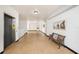 Building hallway featuring an elevator, a bench, and artwork, offering a welcoming space at 2002 Australia E Way # 66, Clearwater, FL 33763