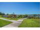 Kayaks and a wooden pier providing access to a peaceful lake for residents' enjoyment at 2002 Australia E Way # 66, Clearwater, FL 33763