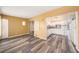 Open-concept space connecting the kitchen to the living area, highlighting the modern flooring and neutral color scheme at 2002 Australia E Way # 66, Clearwater, FL 33763